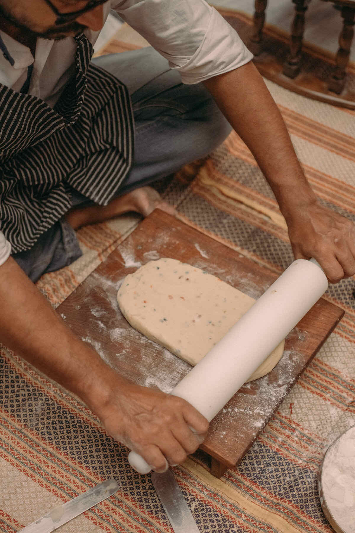 Rolling atta dough by hand
